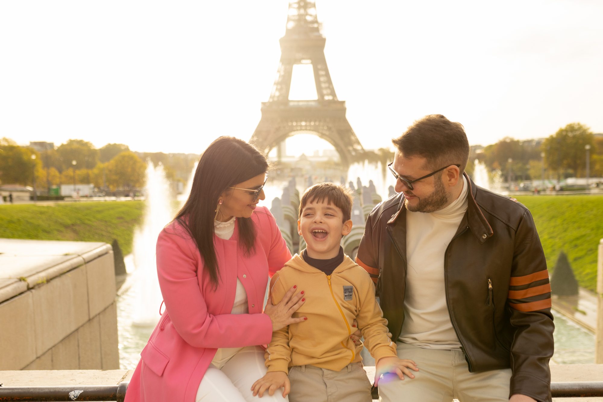 Family portrait by Trocadéro fountain in autumn
